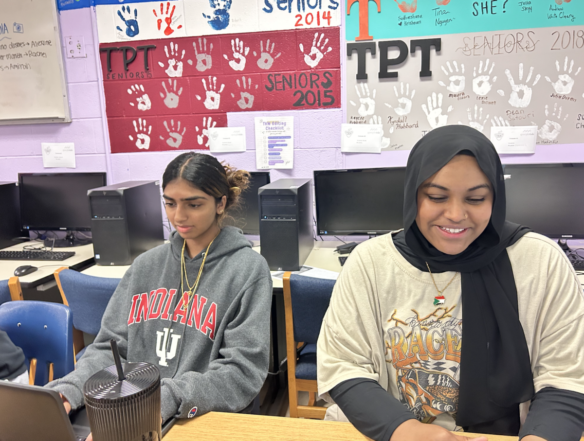 Seniors Nadia Corea and Gayda Makki sit together as they work on their rough drafts on May 2. 
